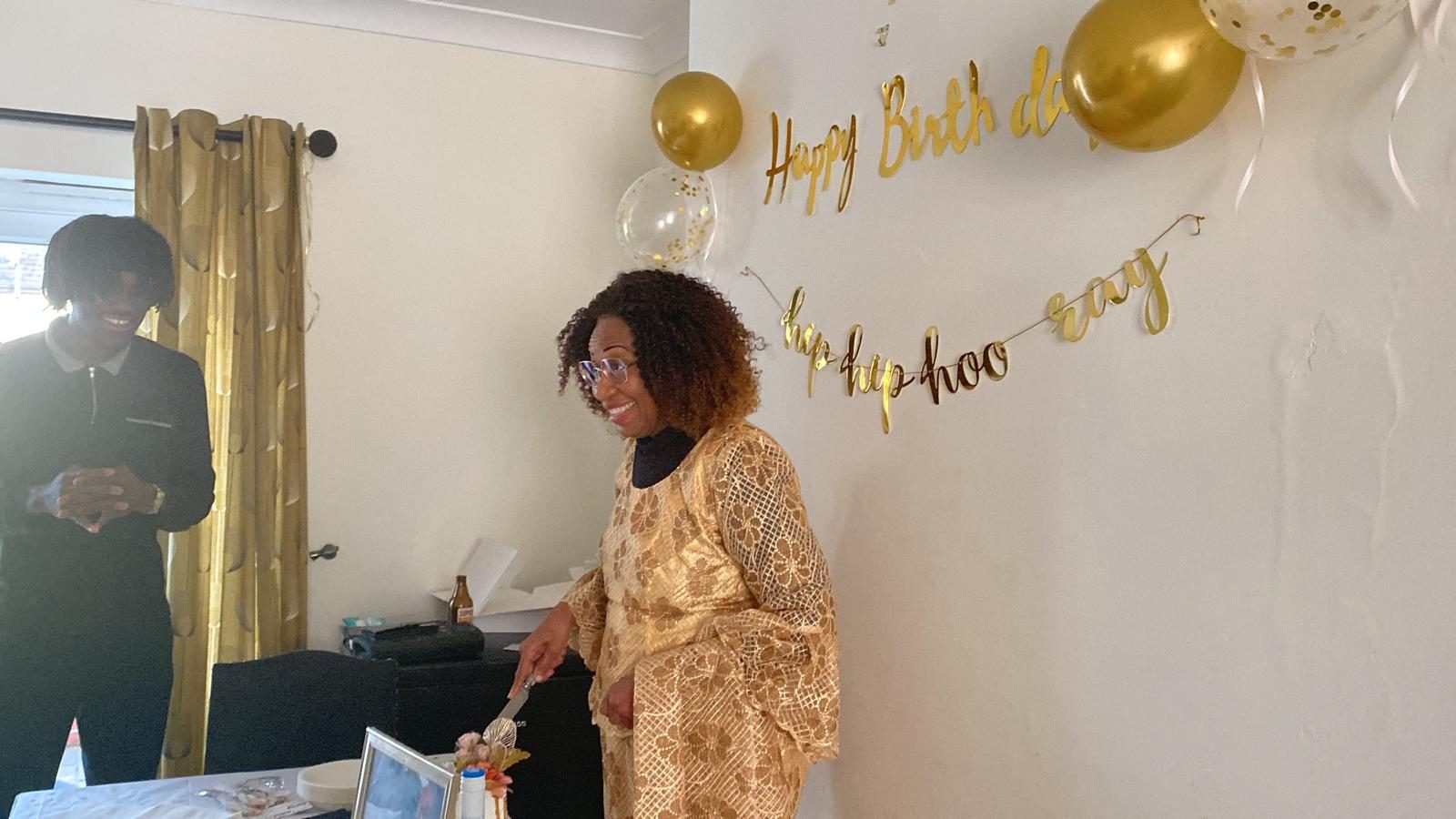 Cutting the birthday cake.