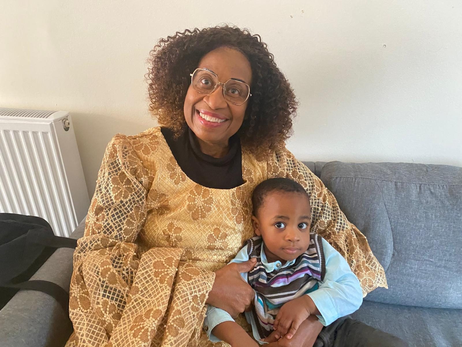 With one of her grandchildren.