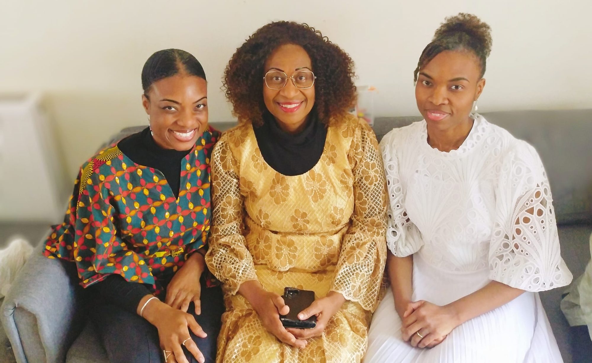 With her sisters.