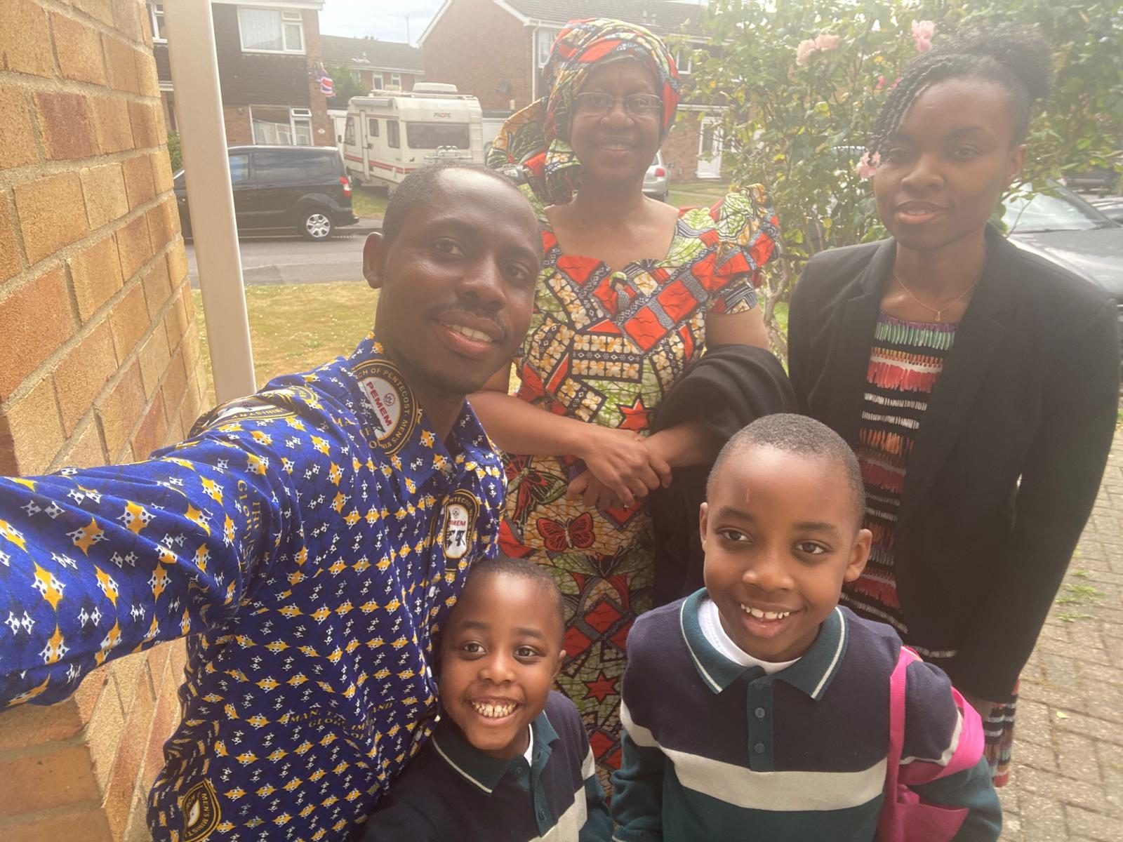 Together with sons and grandchildren.